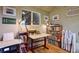 Office features built-in bookshelves, a large window, and a worktable at 2083 W Arbor Ave, Littleton, CO 80120