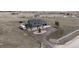 Ariel view of the property showcasing the home, circular driveway, and surrounding landscape at 30484 Chisholm Trl, Elizabeth, CO 80107