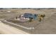 Ariel view of the property showcasing the home, circular driveway, and surrounding landscape at 30484 Chisholm Trl, Elizabeth, CO 80107