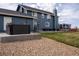 Backyard featuring a hot tub, patio area, and ample space for recreation at 30484 Chisholm Trl, Elizabeth, CO 80107