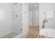 Contemporary bathroom with a glass shower enclosure and a freestanding soaking tub at 30484 Chisholm Trl, Elizabeth, CO 80107
