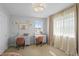 Bright bedroom with two desks, stylish decor, and ample natural light at 30484 Chisholm Trl, Elizabeth, CO 80107