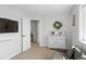 Neutral bedroom with a decorative white dresser and accent furnishings and decor at 30484 Chisholm Trl, Elizabeth, CO 80107