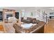 Cozy living room with a brick fireplace, comfortable seating, and an open floor plan at 30484 Chisholm Trl, Elizabeth, CO 80107