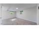 Finished basement featuring neutral carpeting, large window, and versatile open space at 11718 Keough Dr, Northglenn, CO 80233