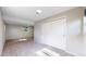 Finished basement with neutral carpet, window to allow for natural light, and a closet for storage at 11718 Keough Dr, Northglenn, CO 80233