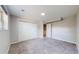 Bright bedroom features neutral carpeting, closet with sliding doors, and a large window at 11718 Keough Dr, Northglenn, CO 80233