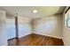 Bedroom with hardwood floors, neutral paint, and ample natural light from window at 11718 Keough Dr, Northglenn, CO 80233