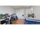Spacious bedroom featuring hardwood floors, a closet with sliding doors, and ample natural light at 11718 Keough Dr, Northglenn, CO 80233
