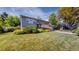 Charming blue two-story home featuring a well-manicured lawn and inviting curb appeal at 11718 Keough Dr, Northglenn, CO 80233