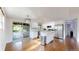 Bright, updated kitchen featuring white cabinets, stainless steel appliances, and granite countertops at 11718 Keough Dr, Northglenn, CO 80233