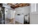 Functional laundry room with washer, dryer, utility sink, and ample storage space at 11718 Keough Dr, Northglenn, CO 80233
