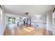 Open living space with lots of light, showcasing hardwood floors and a modern aesthetic at 11718 Keough Dr, Northglenn, CO 80233
