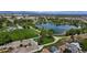 An aerial view of a park with a lake, playground, and walking paths at 11718 Keough Dr, Northglenn, CO 80233