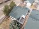 An aerial view of the house showcasing its beautiful green roof, private patio, and lush surrounding greenery at 2573 S Troy Ct, Aurora, CO 80014