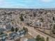 An aerial view showcases the home's neighborhood and the surrounding community, perfect for families and individuals alike at 2573 S Troy Ct, Aurora, CO 80014