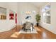 Bright dining room with a large window, stylish lighting, and hardwood flooring, ideal for Gathering meals at 2573 S Troy Ct, Aurora, CO 80014