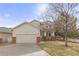Charming two-story home featuring a two-car garage and inviting facade in a serene neighborhood at 2573 S Troy Ct, Aurora, CO 80014