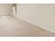 Open living room bathed in light with neutral colored walls and plush carpet at 2573 S Troy Ct, Aurora, CO 80014