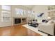 Bright living room features a fireplace, large windows, and an open layout, perfect for relaxation at 2573 S Troy Ct, Aurora, CO 80014