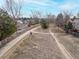 A beautiful shot showcasing the sidewalk trail winding through the neighborhood and picturesque surroundings at 2573 S Troy Ct, Aurora, CO 80014