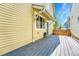 Backyard featuring a composite deck and an access door at 1903 W 66Th Ave, Denver, CO 80221