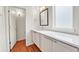 Bathroom features a single-sink vanity and a view to an adjacent space at 1903 W 66Th Ave, Denver, CO 80221