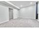 Bedroom featuring gray carpet and an open doorway to an adjacent room at 1903 W 66Th Ave, Denver, CO 80221