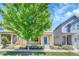 Street view of a two-story home with a blue door and a cozy, covered front porch at 1903 W 66Th Ave, Denver, CO 80221