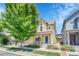 Inviting two-story home with a blue door, balcony, covered front porch and an American flag at 1903 W 66Th Ave, Denver, CO 80221