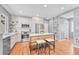 Modern kitchen with stainless steel appliances, a center island, and stylish lighting at 1903 W 66Th Ave, Denver, CO 80221