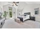 Spacious main bedroom featuring high ceilings, large windows, and neutral decor at 1903 W 66Th Ave, Denver, CO 80221