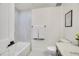 Bright bathroom with tiled shower/tub, marble countertops, modern fixtures and decor at 1308 Snowberry Ln # 302, Louisville, CO 80027