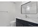 Bathroom with dark vanity and white quartz countertop at 1308 Snowberry Ln # 302, Louisville, CO 80027