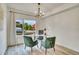 Bright home office featuring a modern chandelier and large window with neighborhood views at 1308 Snowberry Ln # 302, Louisville, CO 80027