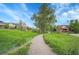 Inviting pathway leading through a lush, green landscape offering a serene walking experience at 1308 Snowberry Ln # 302, Louisville, CO 80027