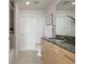Bathroom featuring a granite countertop, wood cabinetry, and a decorative plant for a fresh touch at 1700 Bassett St # 1106, Denver, CO 80202