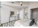 Bright bedroom with light decor, modern lighting, and a glimpse into the kitchen area, creating an inviting atmosphere at 1700 Bassett St # 1106, Denver, CO 80202
