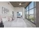 Serene bedroom with city views, concrete ceiling, and plush bedding, creating a comfortable and inviting space at 1700 Bassett St # 1106, Denver, CO 80202