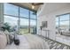 Modern bedroom featuring floor-to-ceiling windows and stunning city views, perfect for relaxation and enjoying the scenery at 1700 Bassett St # 1106, Denver, CO 80202