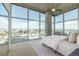 Bright bedroom with floor-to-ceiling windows, offering stunning city views and filling the room with natural light at 1700 Bassett St # 1106, Denver, CO 80202