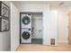 Convenient laundry closet with a stacked washer and dryer unit at 1700 Bassett St # 1106, Denver, CO 80202
