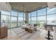 Bright living room features floor-to-ceiling windows with city views, modern furnishings, and stylish decor at 1700 Bassett St # 1106, Denver, CO 80202