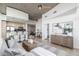 Open concept living area with a modern kitchen, dining space, and comfortable seating area, filled with natural light at 1700 Bassett St # 1106, Denver, CO 80202