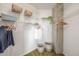 Organized walk-in closet with wire shelving, offering ample space for clothing and accessories, featuring concrete details at 1700 Bassett St # 1106, Denver, CO 80202