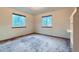 Bedroom with two windows providing natural light and a built-in shelf at 9670 W 70Th Ave, Arvada, CO 80004