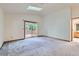 Bright bedroom featuring a sliding glass door and a large skylight at 9670 W 70Th Ave, Arvada, CO 80004