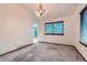 Bright dining room with modern lighting and a large window at 9670 W 70Th Ave, Arvada, CO 80004