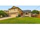 Charming two-story home with a well-manicured lawn and attached garage at 9670 W 70Th Ave, Arvada, CO 80004