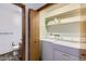 Laundry room with washer, dryer, storage shelves, and a half bathroom at 9670 W 70Th Ave, Arvada, CO 80004